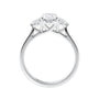 Oval diamond 3 stone engagement ring with small side diamonds 18ct white gold side view.