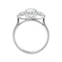 Lab grown diamond trilogy style engagement ring with pear sides white gold side view.