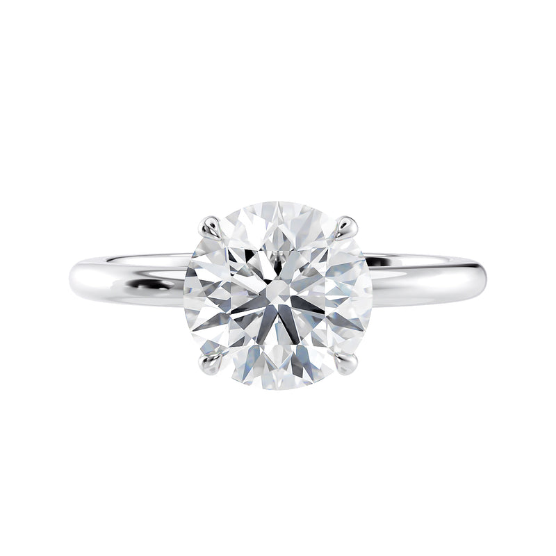 Round brilliant solitaire natural diamond engagement ring in white gold front view. 