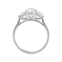 Round brilliant cut 3 stone diamond engagement ring white gold side view.