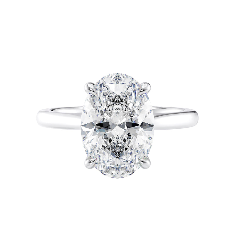 Hidden halo oval solitaire engagement ring white gold front view.