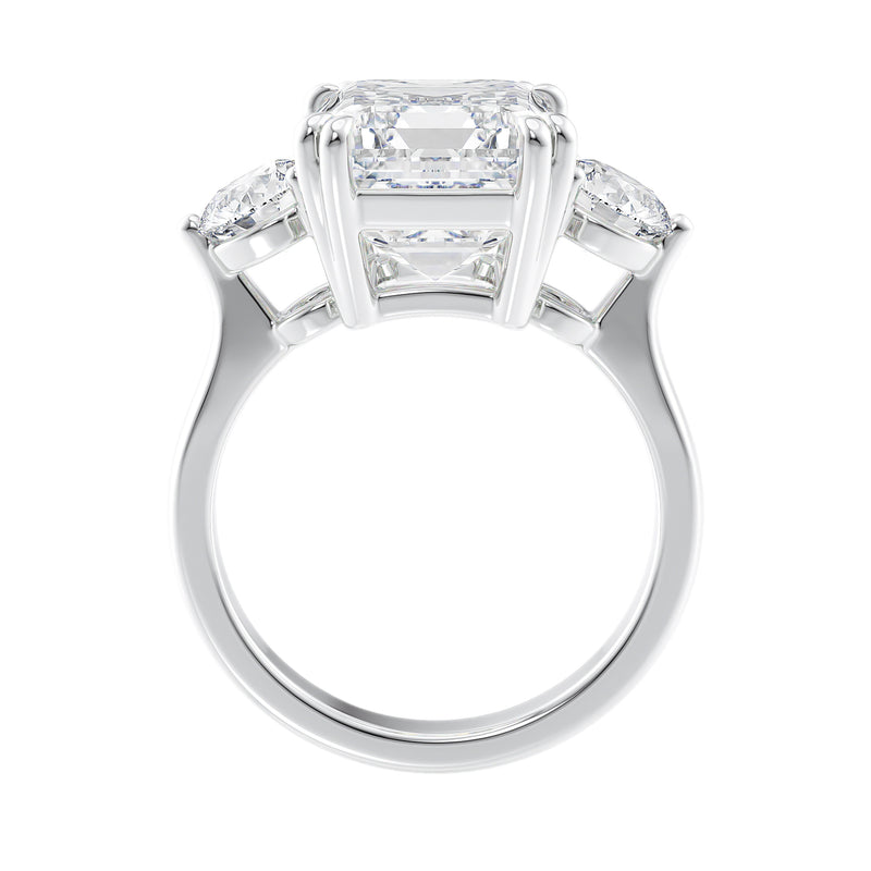 Emerald cut 3 stone diamond engagement ring 18ct white gold side view.