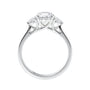 Round brilliant cut diamond 3 stone engagement ring with small side diamonds white gold side view.