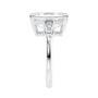 Emerald cut laboratory grown diamond engagement ring with tapered baguette shoulders white gold end view.