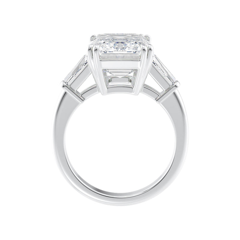 Emerald cut laboratory grown diamond engagement ring with tapered baguette shoulders white gold side view.