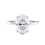 Hidden halo oval lab grown diamond engagement ring slim band white gold front view.