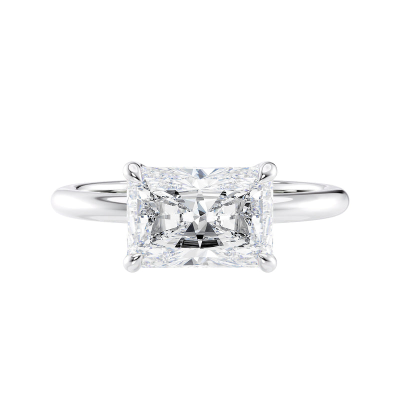 Radiant cut lab grown diamond east-west set on thin band white gold front view.