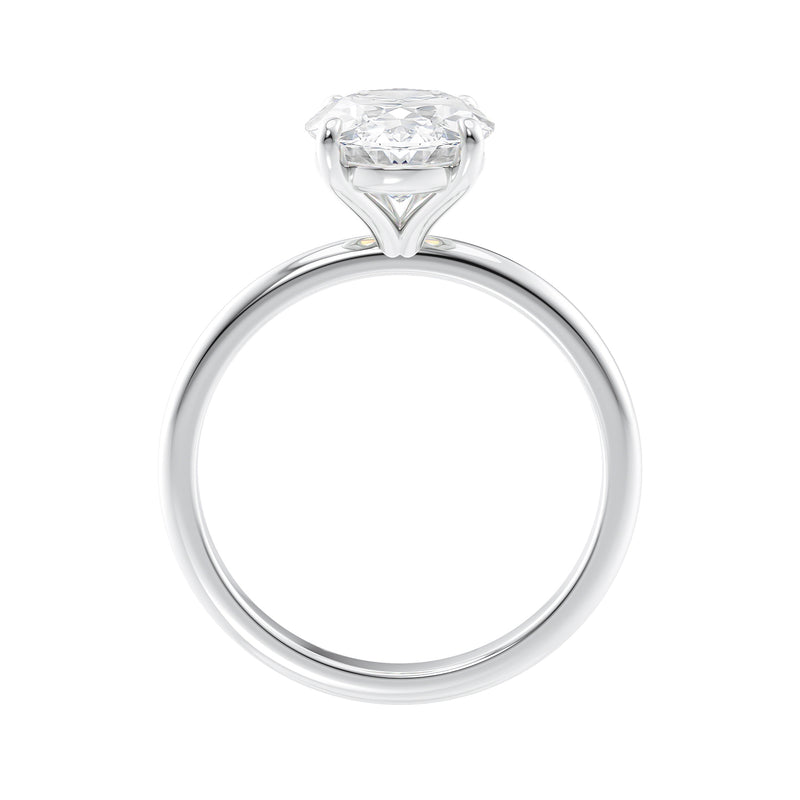 Slim white gold band oval solitaire engagement ring side view.