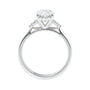 Lab grown oval diamond engagement ring with trilogy diamond set shoulders 18ct white gold side view.