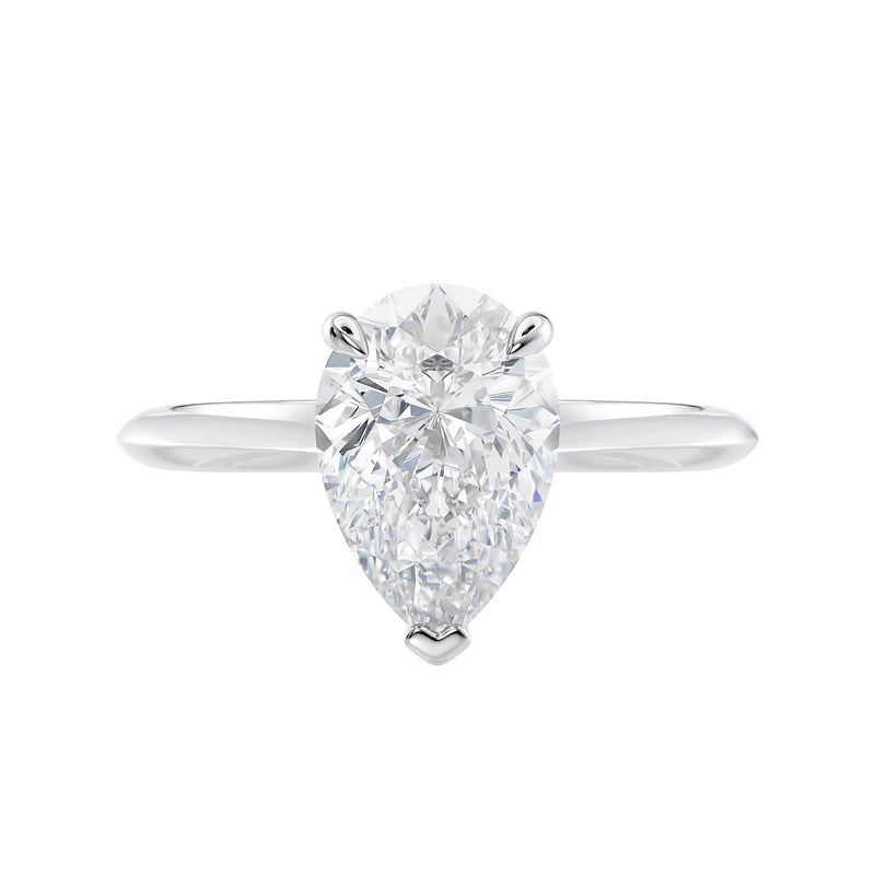 Natural pear cut diamond engagement ring with a hidden halo and white gold band front view.