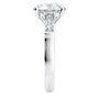 Round brilliant cut lab grown diamond engagement ring with tapered baguette side stones 18ct white gold end view.