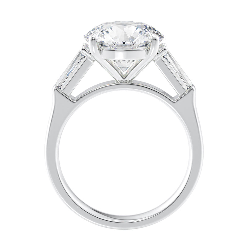 Round brilliant cut lab grown diamond engagement ring with tapered baguette side stones 18ct white gold side view.