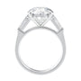 Round brilliant cut lab grown diamond engagement ring with tapered baguette side stones 18ct white gold side view.